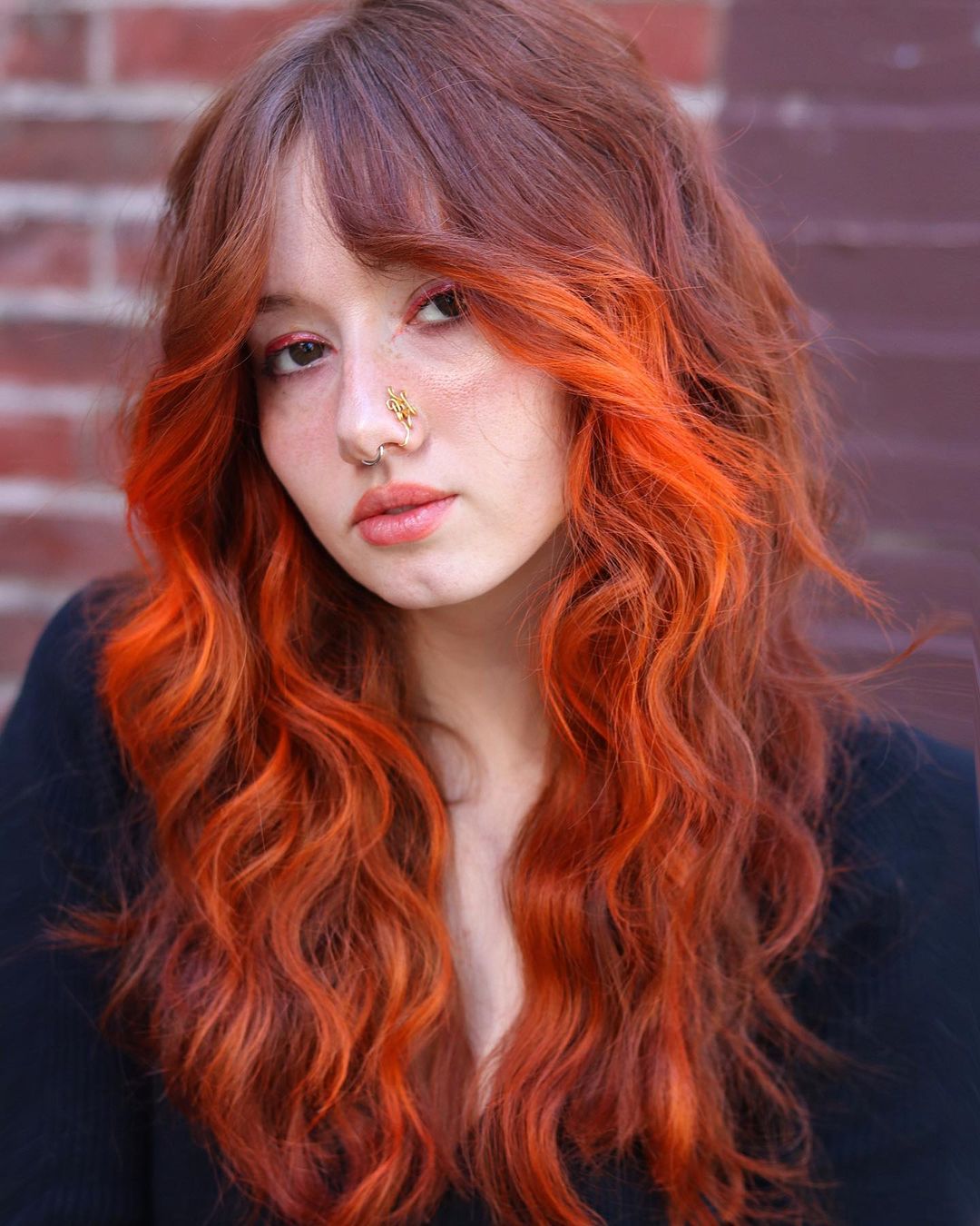 Bright Orange Highlights on Long Wavy Hair