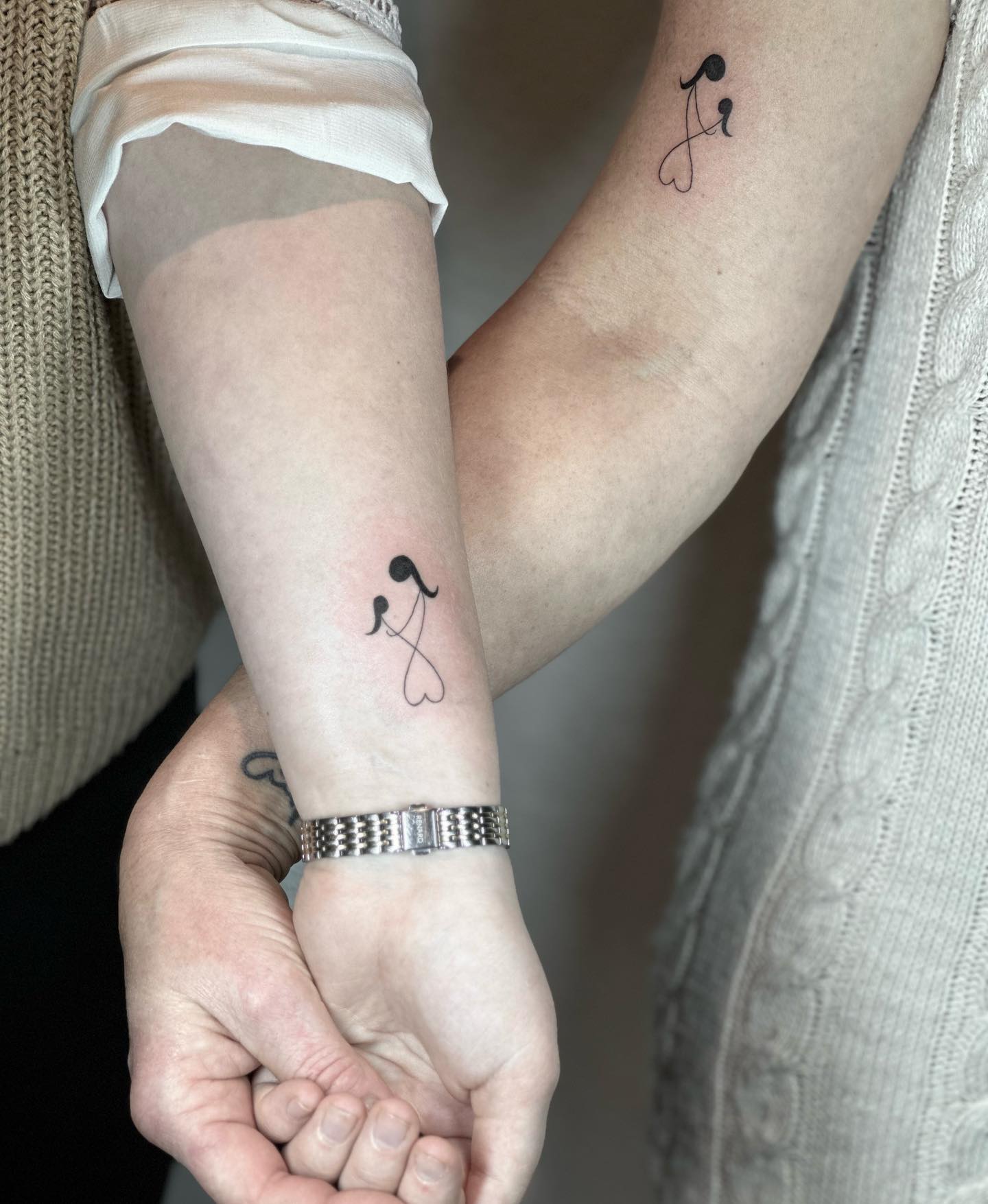 Mother and Daughter Small Symbol Tattoos on Arm and Wrist