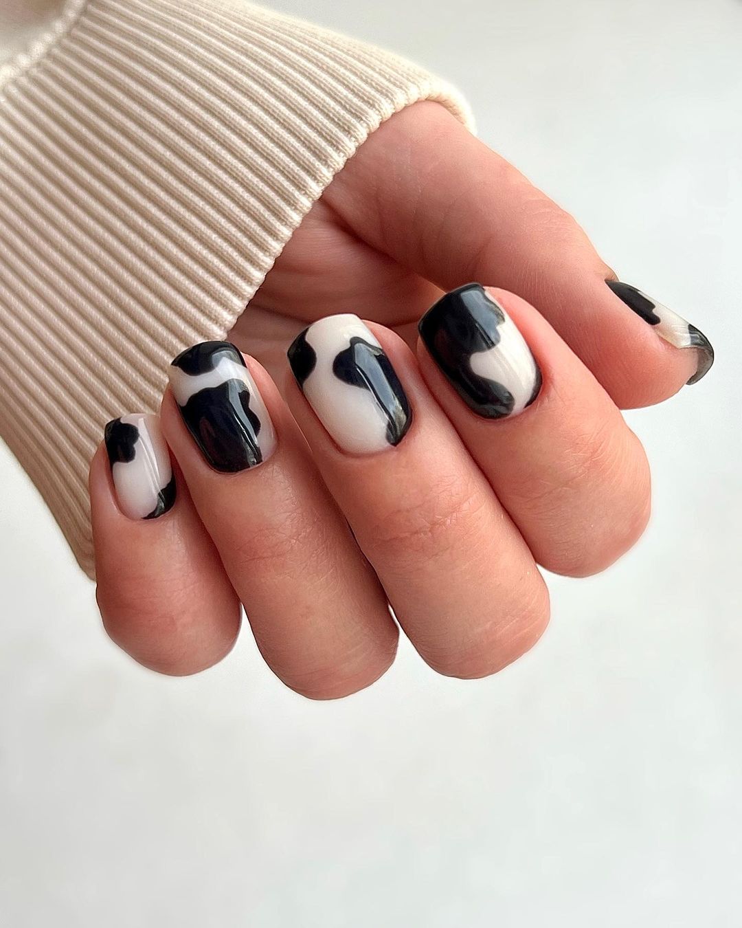 Short Black and White Gel Nails with Cow Print