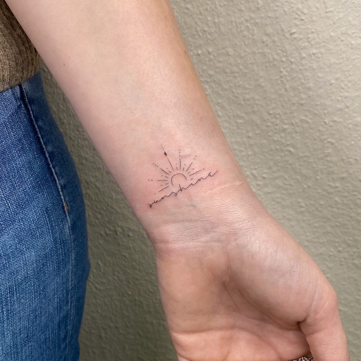 Small Tattoo of Sunshine on Wrist