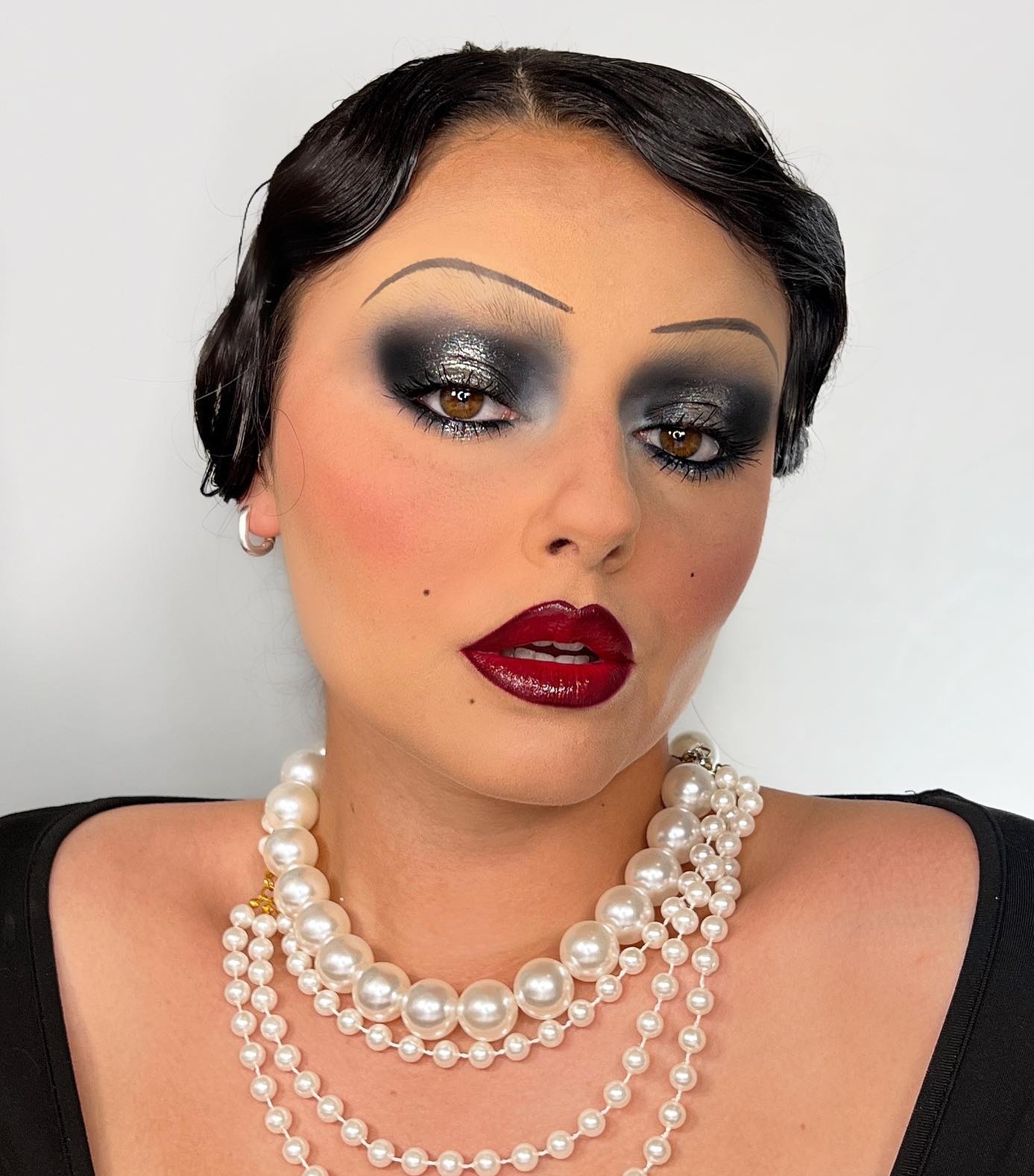 1920s Makeup with Glitter Black Eyeshadow and Dark Red Lips