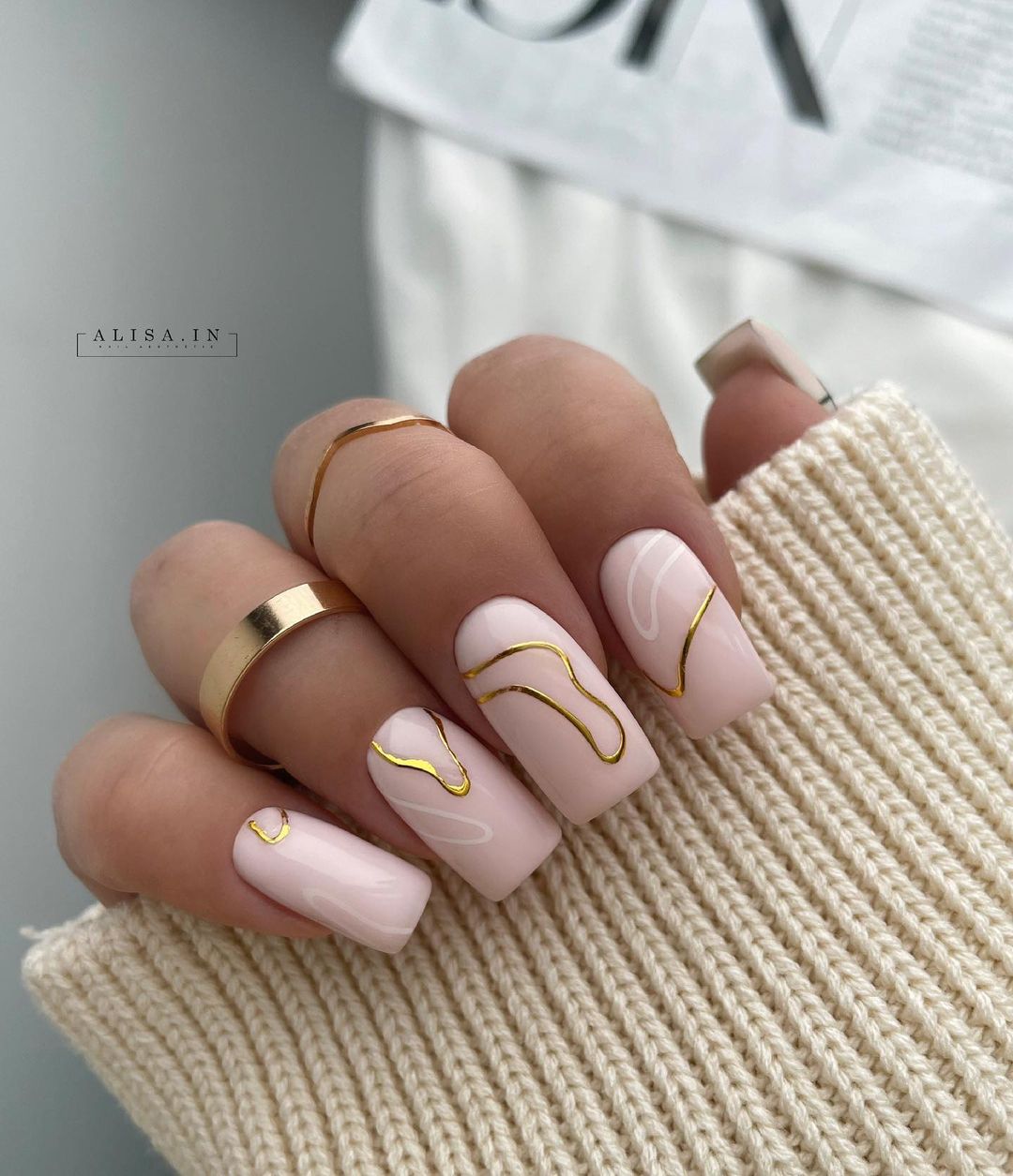 Long Square Beige Gel Nails with Gold Lines