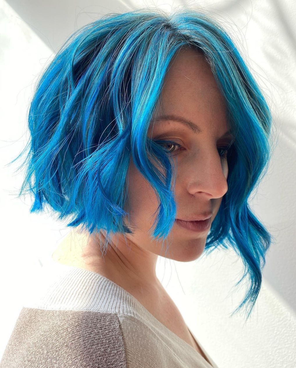 Messy Asymmetrical Bob Cut on Blue Hair