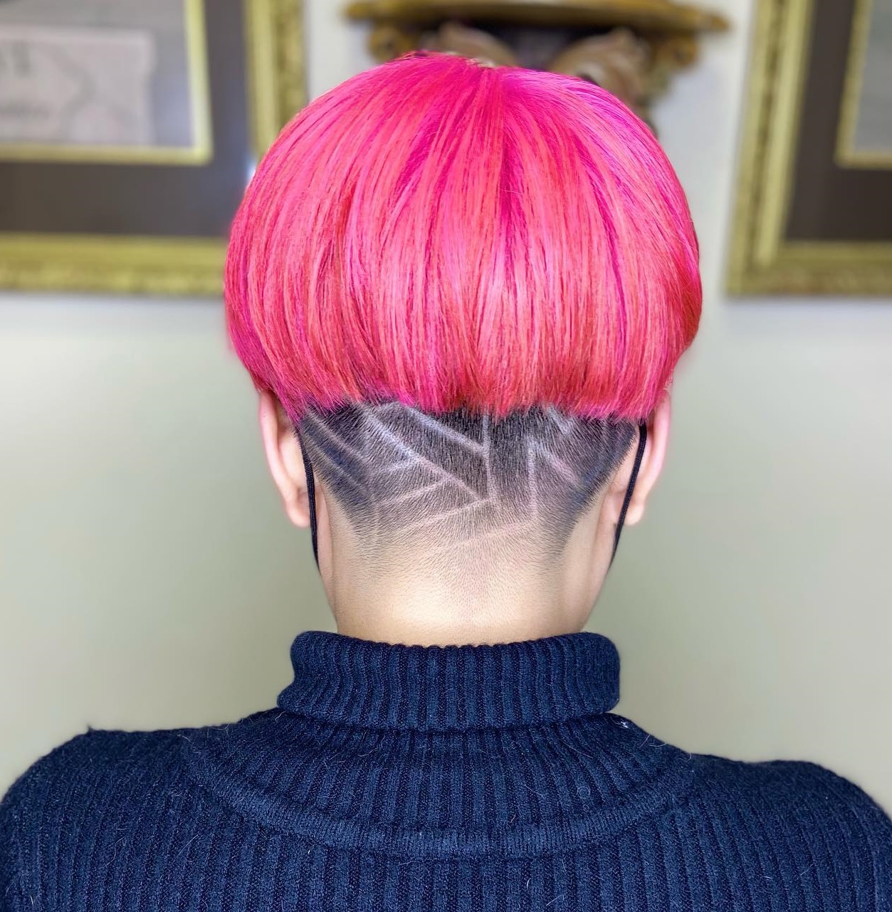 Neon Pink Bowl Hairstyle with Undercut