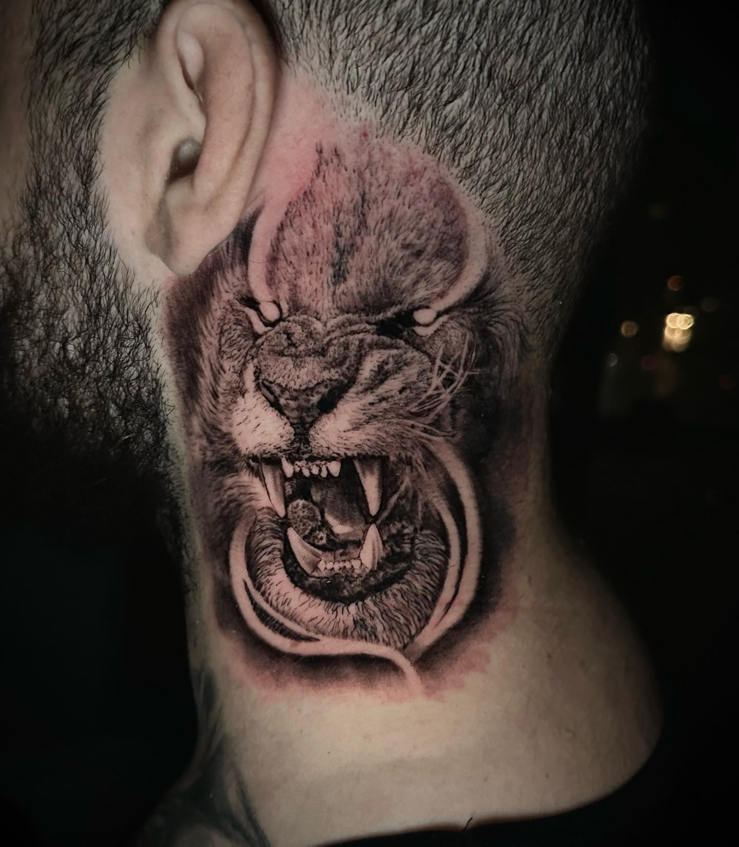 Roaring Lion Tattoo on Neck