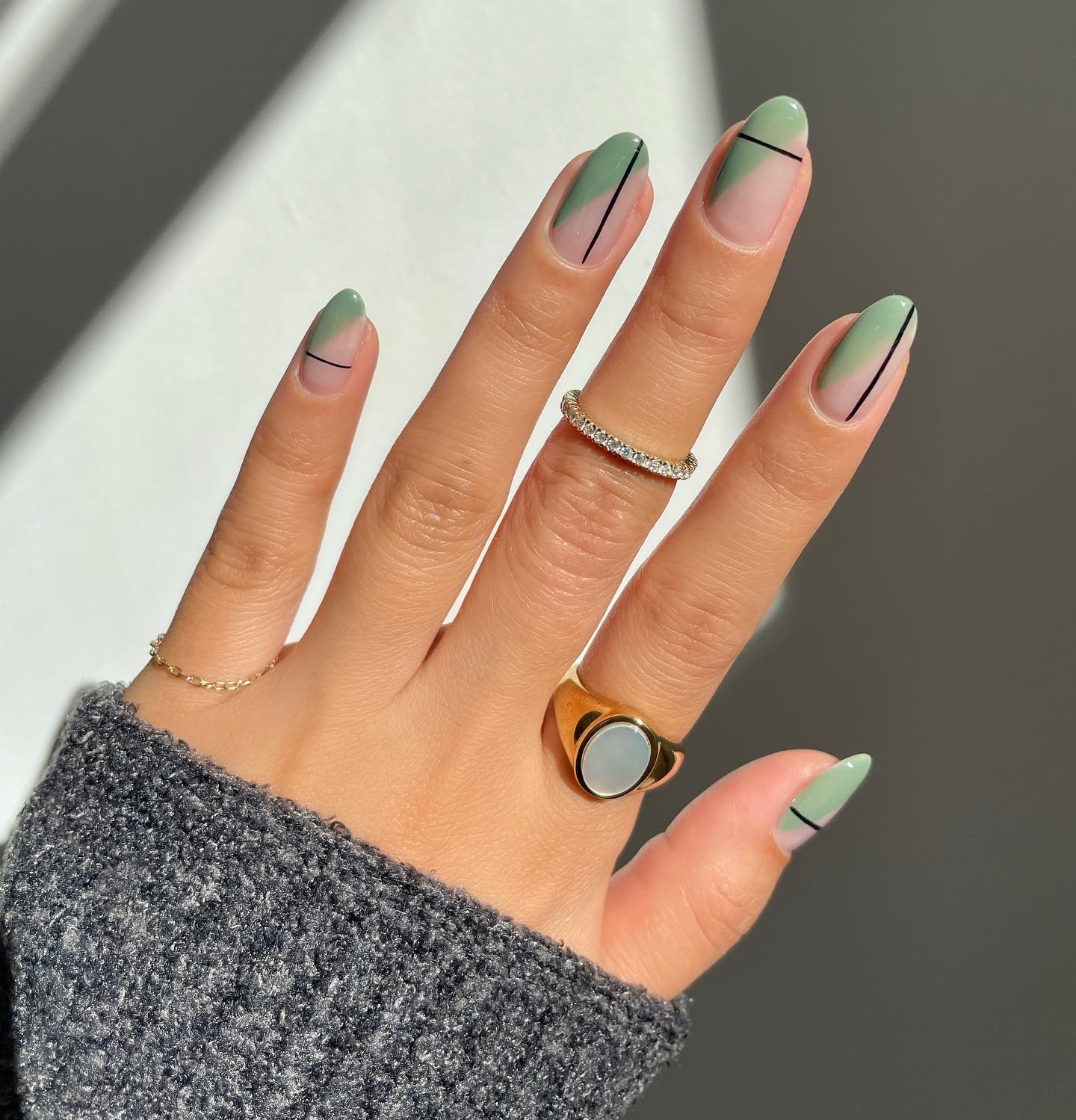 Short Round Light Green Nails with Thin Black Lines