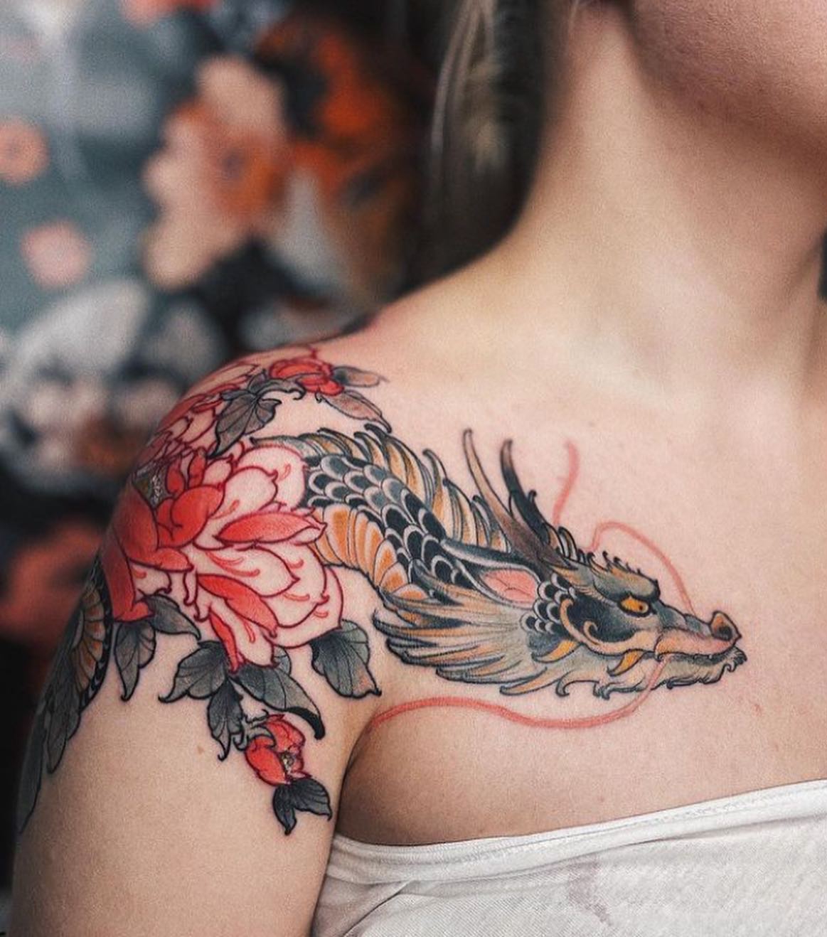 Colorful Dragon with Red Flowers Tattoo on Chest