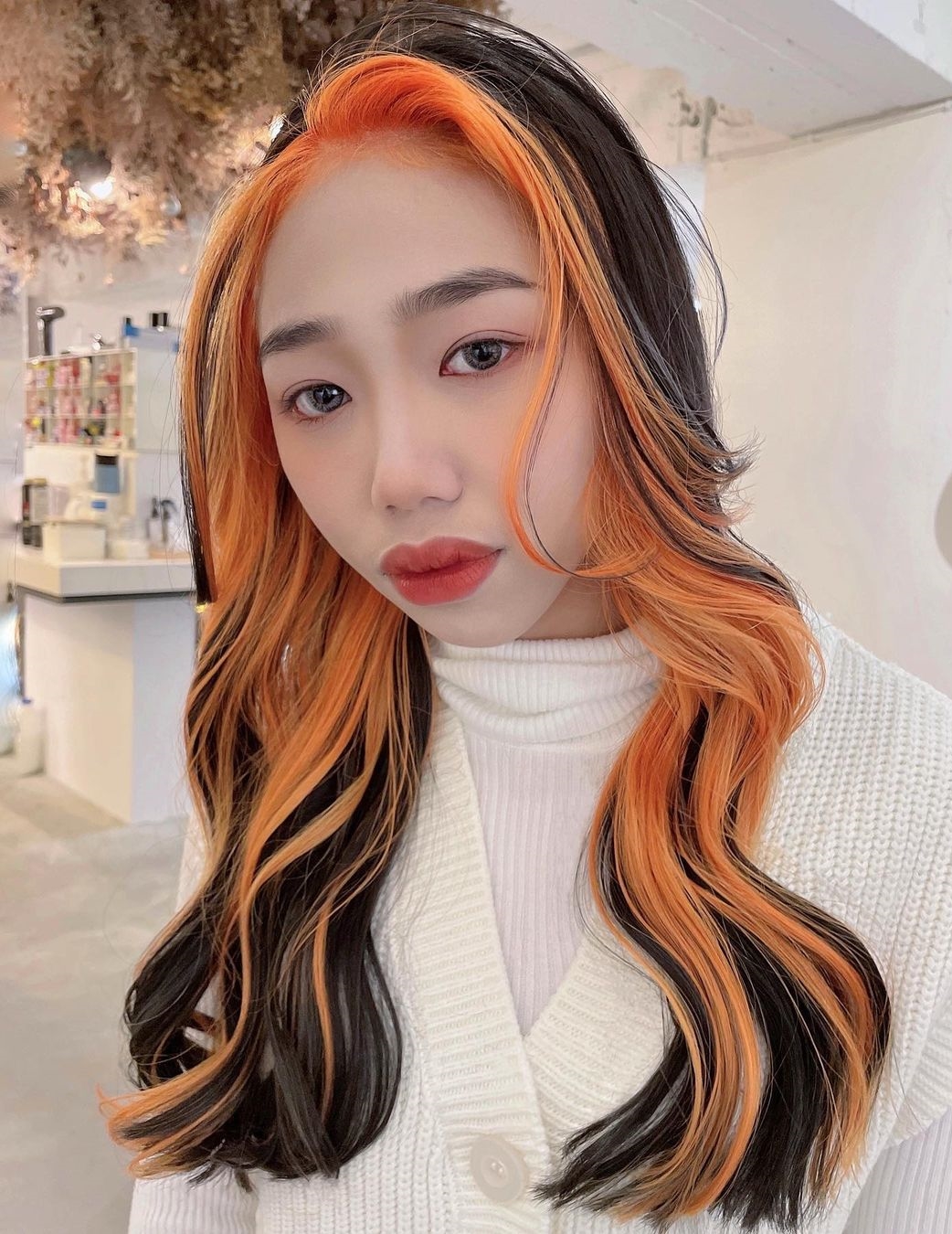 Orange Peekaboo Hair on Long Black Hair