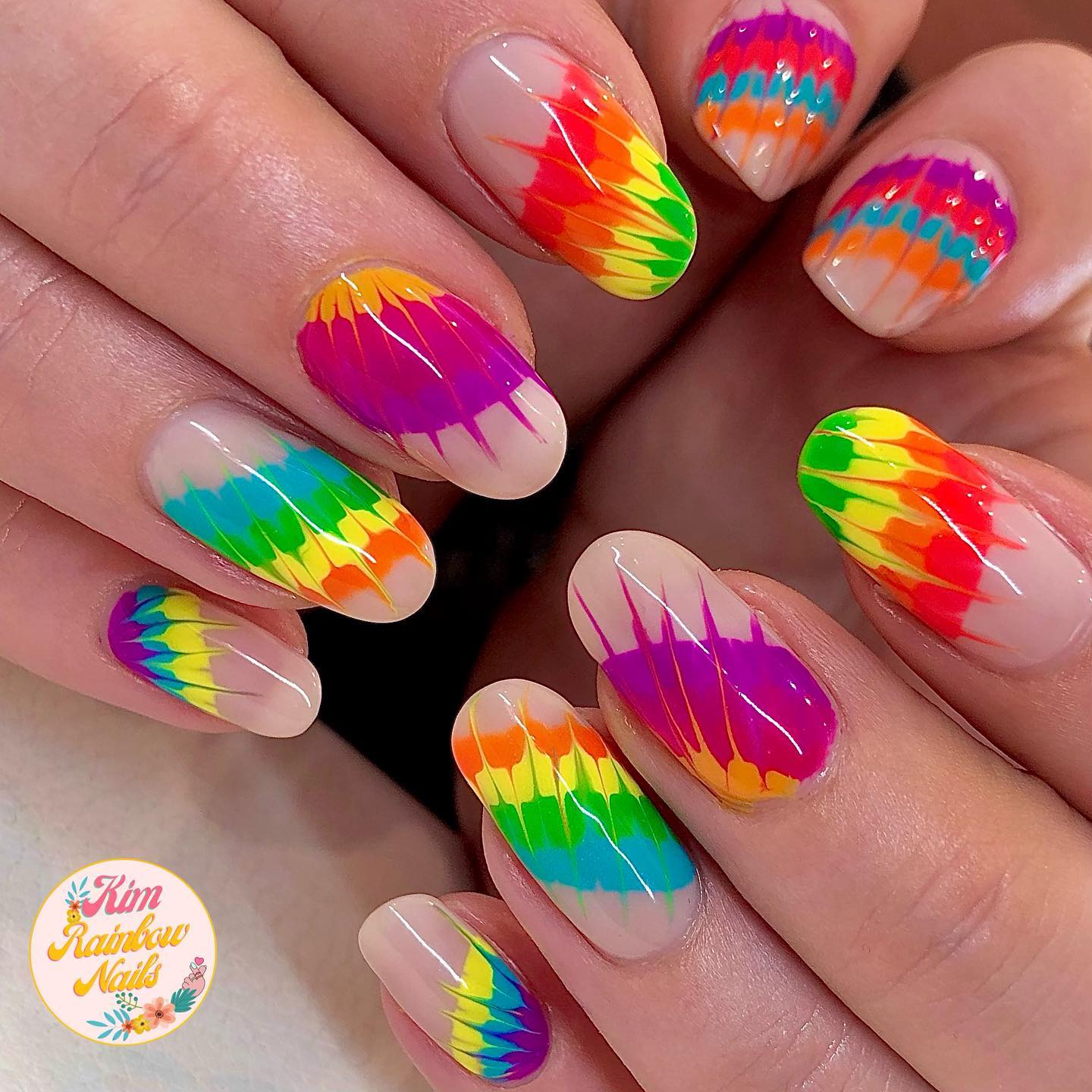 Round Nails with Rainbow Splash Design