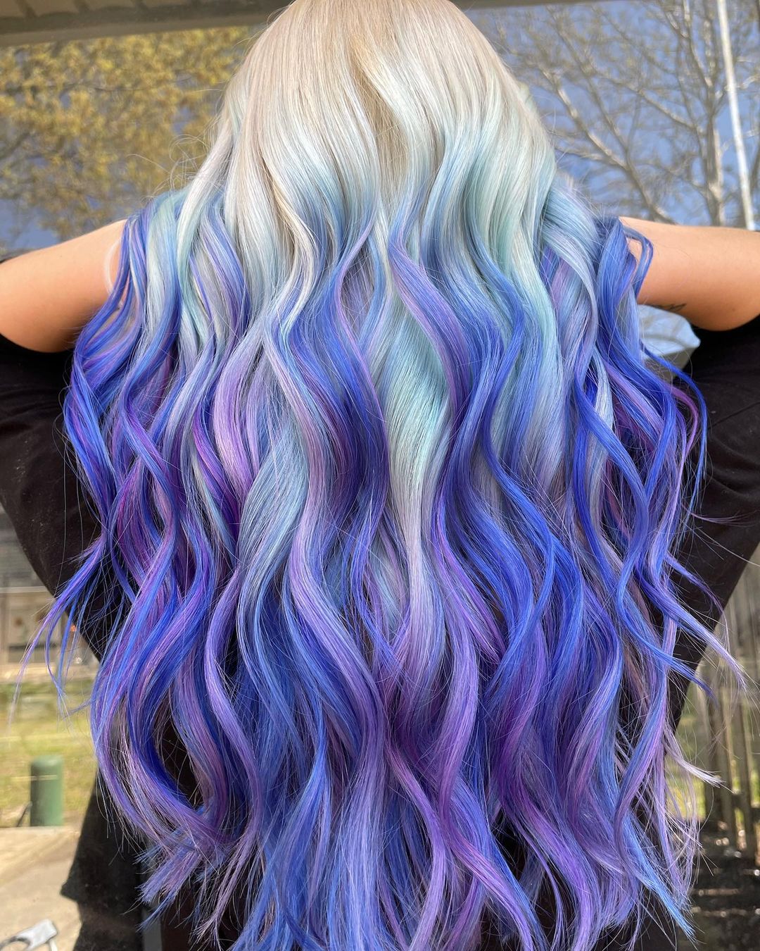 Blond to Purple and Blue Reverse Ombre on Long Wavy Hair