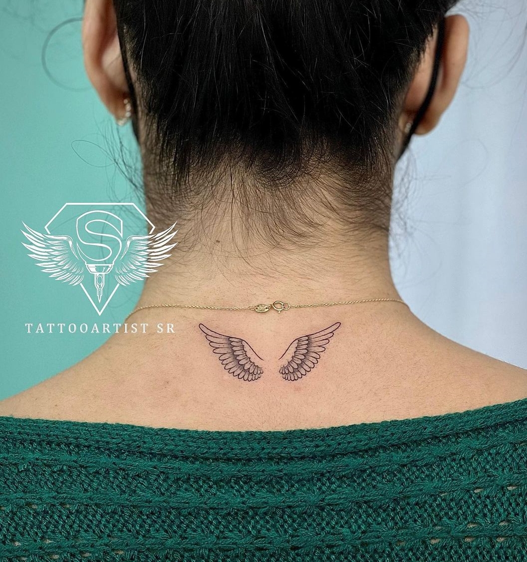 Small Wing Tattoo on the Back of the Neck for Women