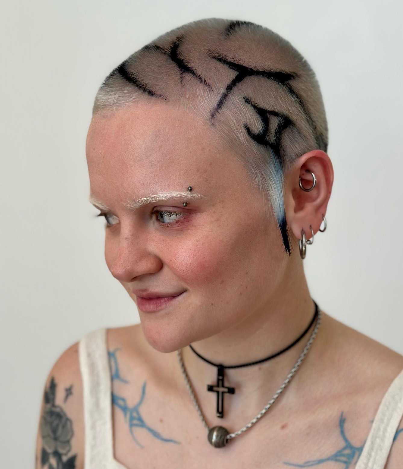 Buzz Cut on Blonde Hair with Black Design for a Round Face