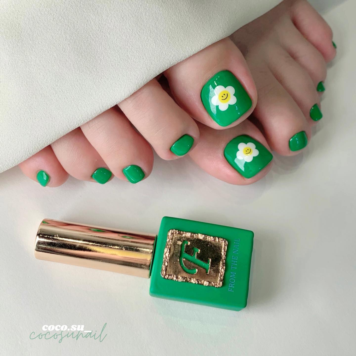 Grass Green Toe Nails with White Flower on Big Toes