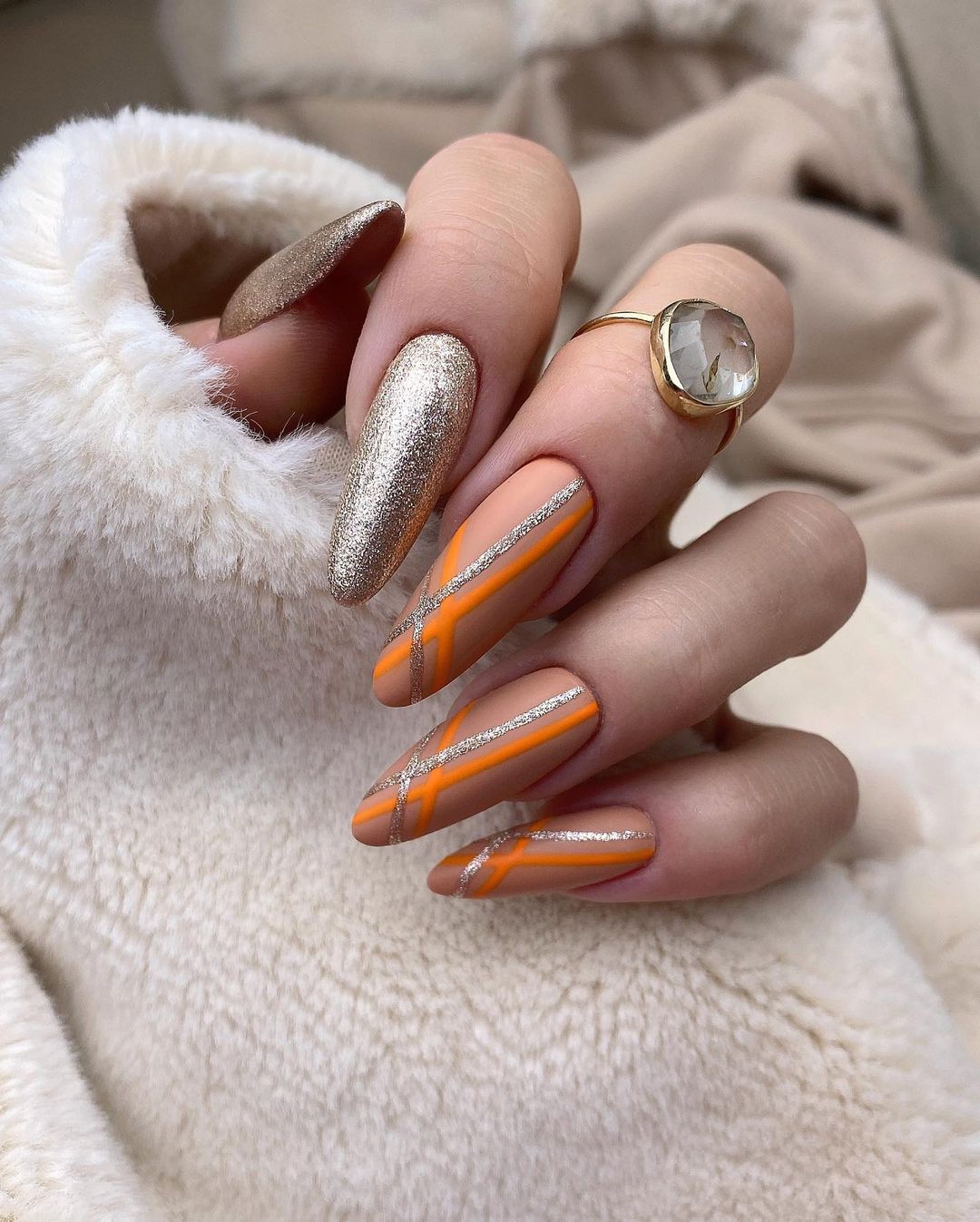 Long Almond Nails with Orange and Silver Lines