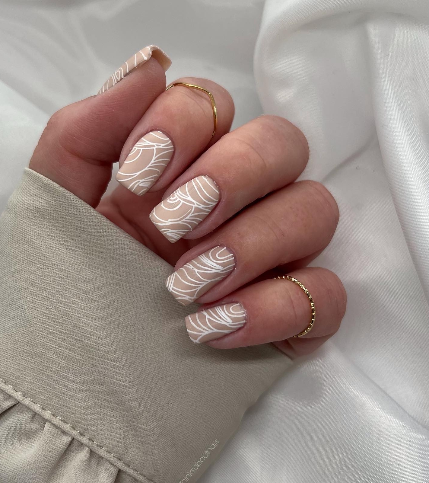 Short Square Beige Nails with Abstract White Lines