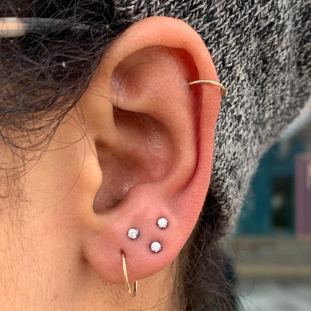 Triple Ear Piercing Style Using Small Rhinestone Earrings