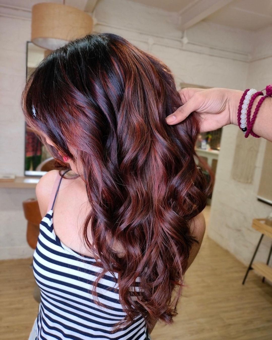 Wavy Dark Brown Hair with Metallic Red Highlights