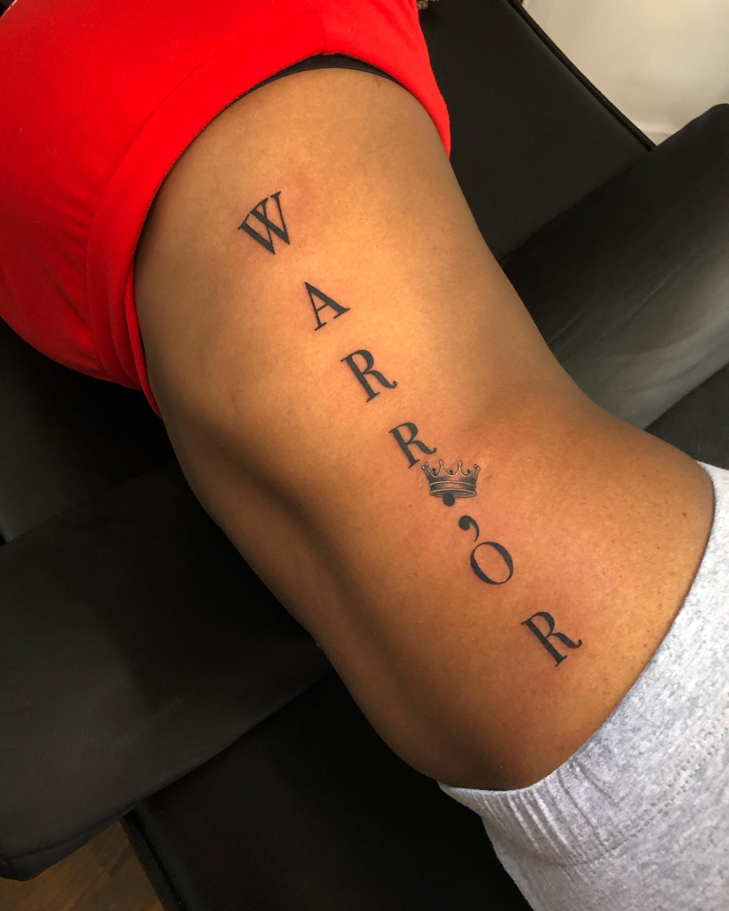 Word WARRIOR Tattoo on the Side