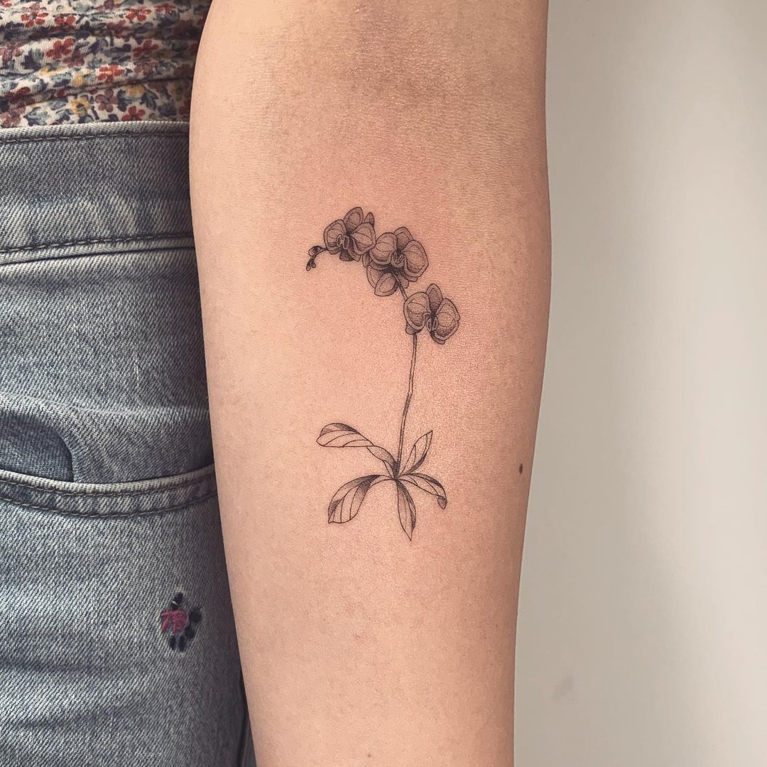 Feminine Minimalist Orchid Tattoo