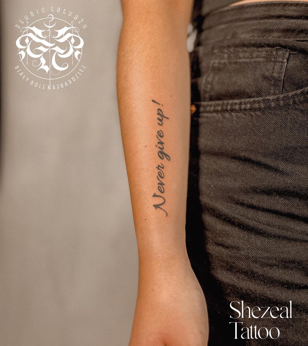 Quote Tattoo “Never Give Up” on Arm