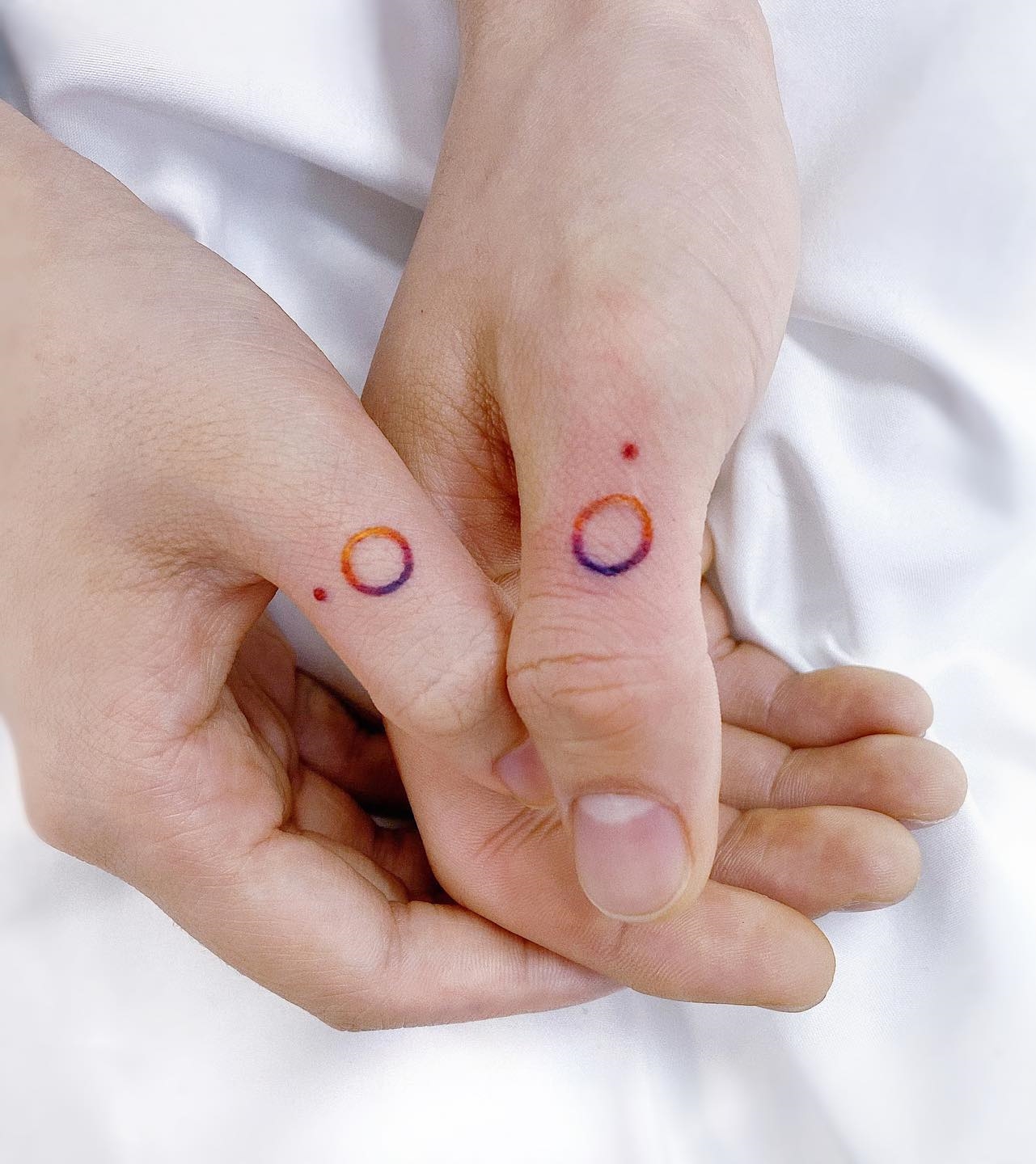 Ring Matching Tattoos on Thumbs