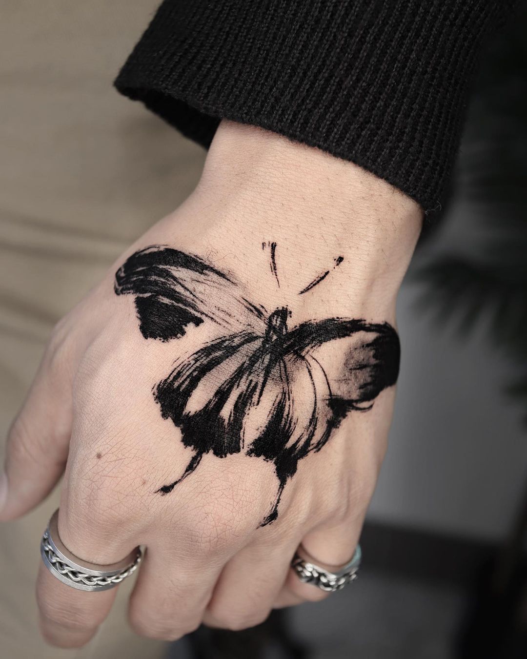Black Butterfly Tattoo on Hand