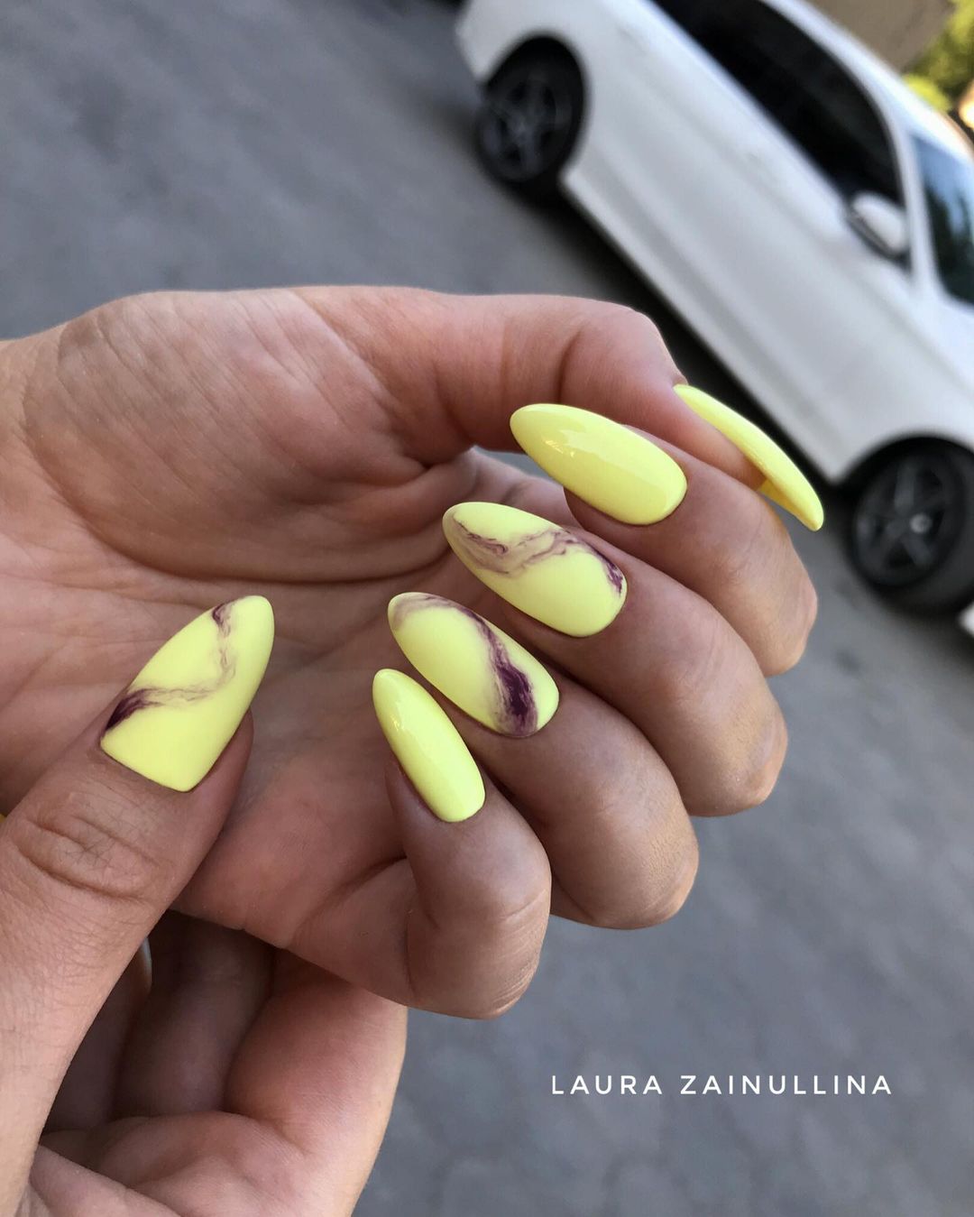 Bright Yellow Nails with Brown Marble Design