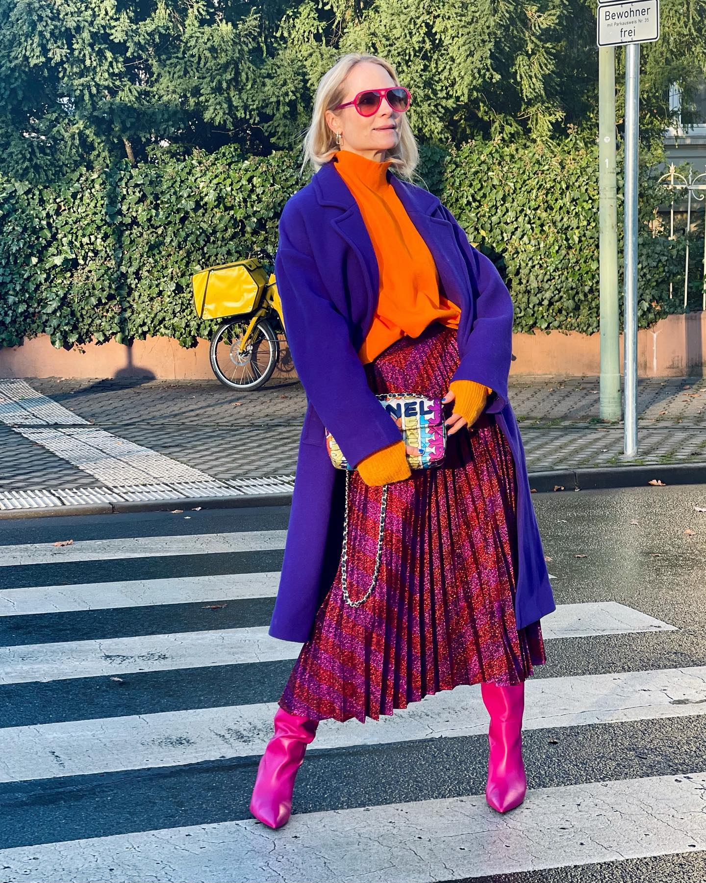 Colorful Pleated Skirt with Orange Blouse and Blue Coat