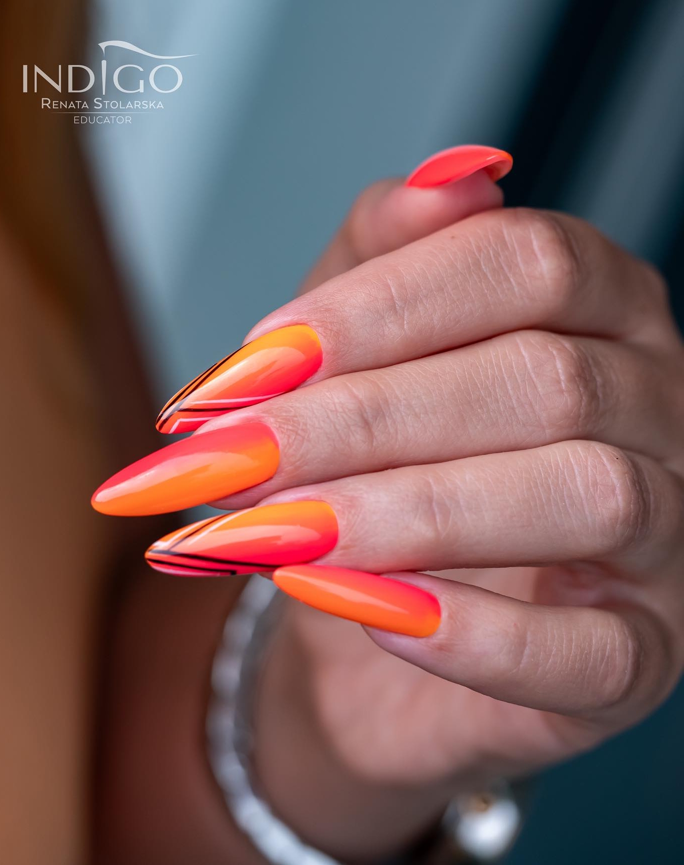 Long Red and Orange Nails with Black Lines