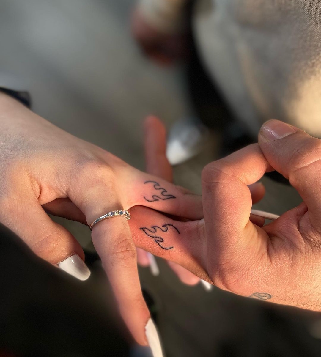 Matching Flame Tattoos Inside Middle Fingers