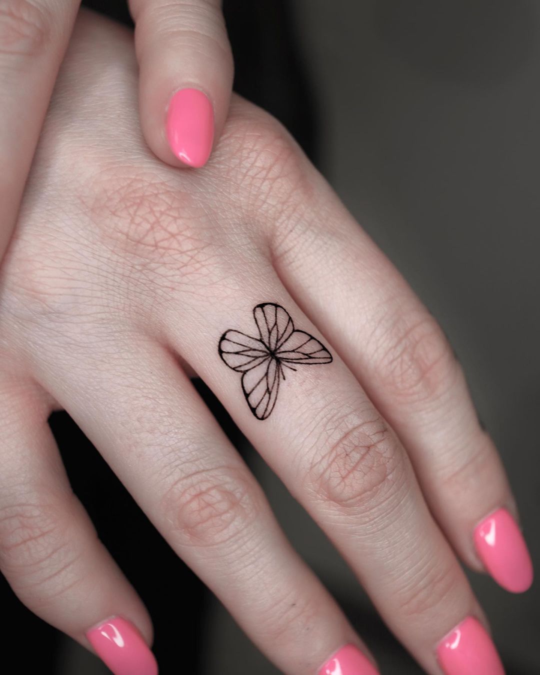 Black Butterfly Tattoo on Middle Finger