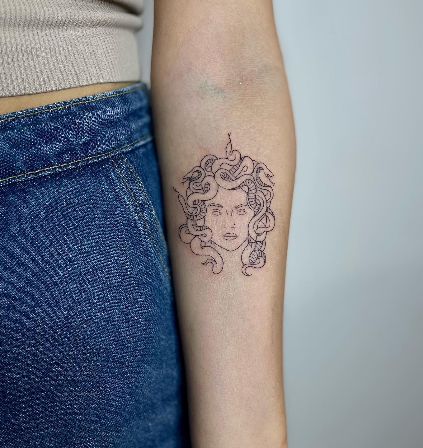 Tiny Medusa Tattoo on Arm