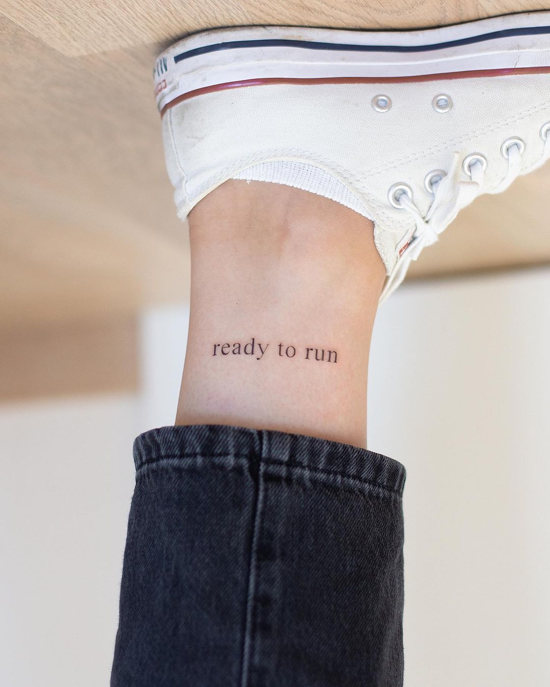 Upside Down Quote Tattoo on Ankle