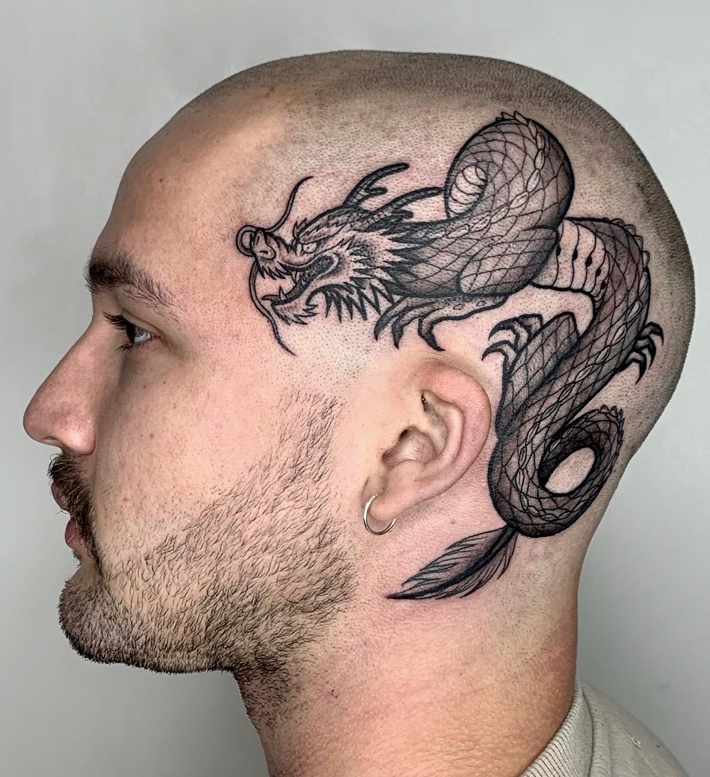 Black Dragon Tattoo on the Side of the Head