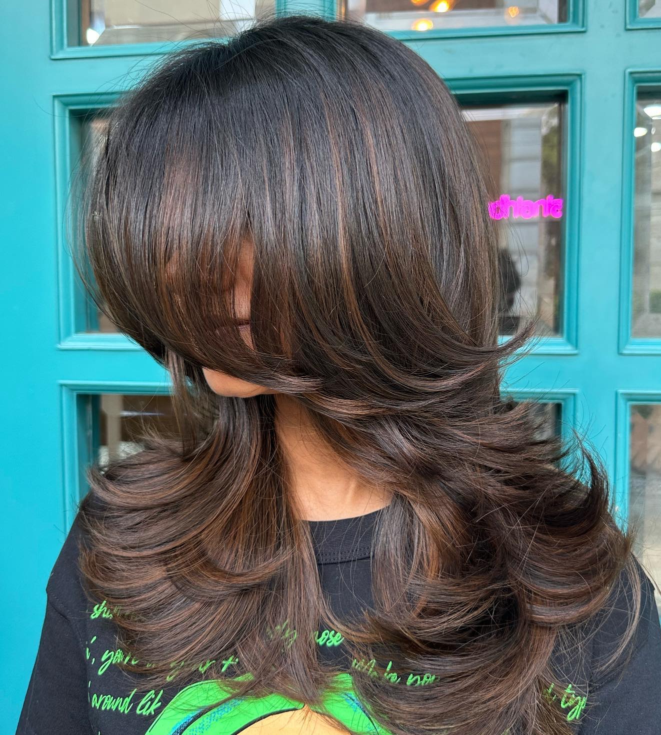 Long Brown Feathered Hairstyle with Highlights