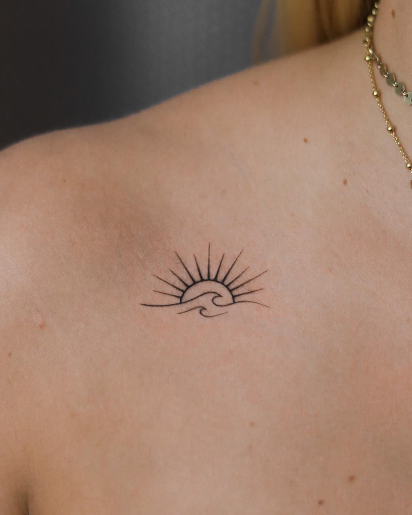 Small Sun Tattoo on Shoulder