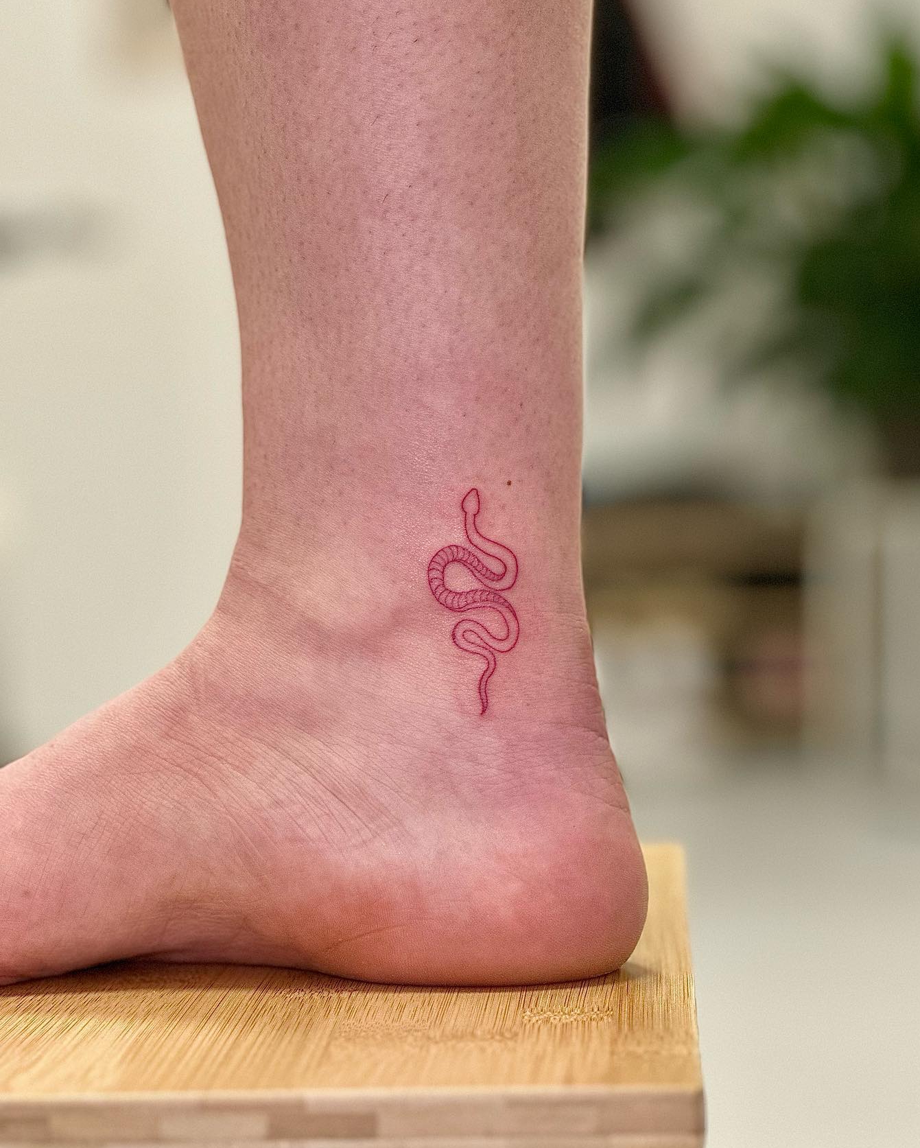 Tiny Chinese Snake Tattoo on Ankle