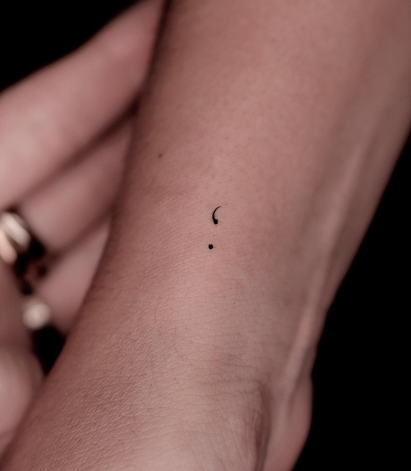 Tiny Semicolon Tattoo on Wrist