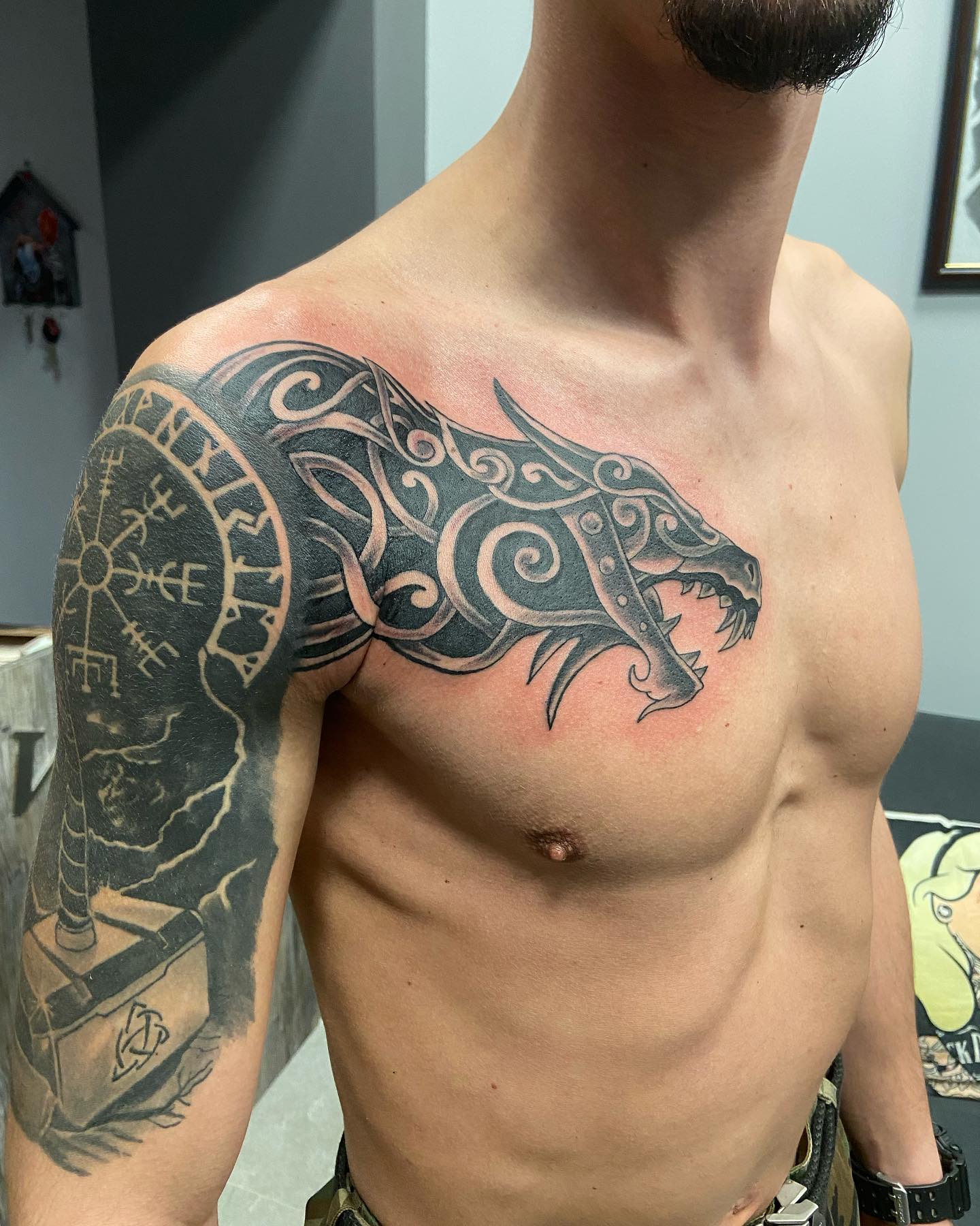 Large Celtic Dragon Tattoo on Arm and Chest