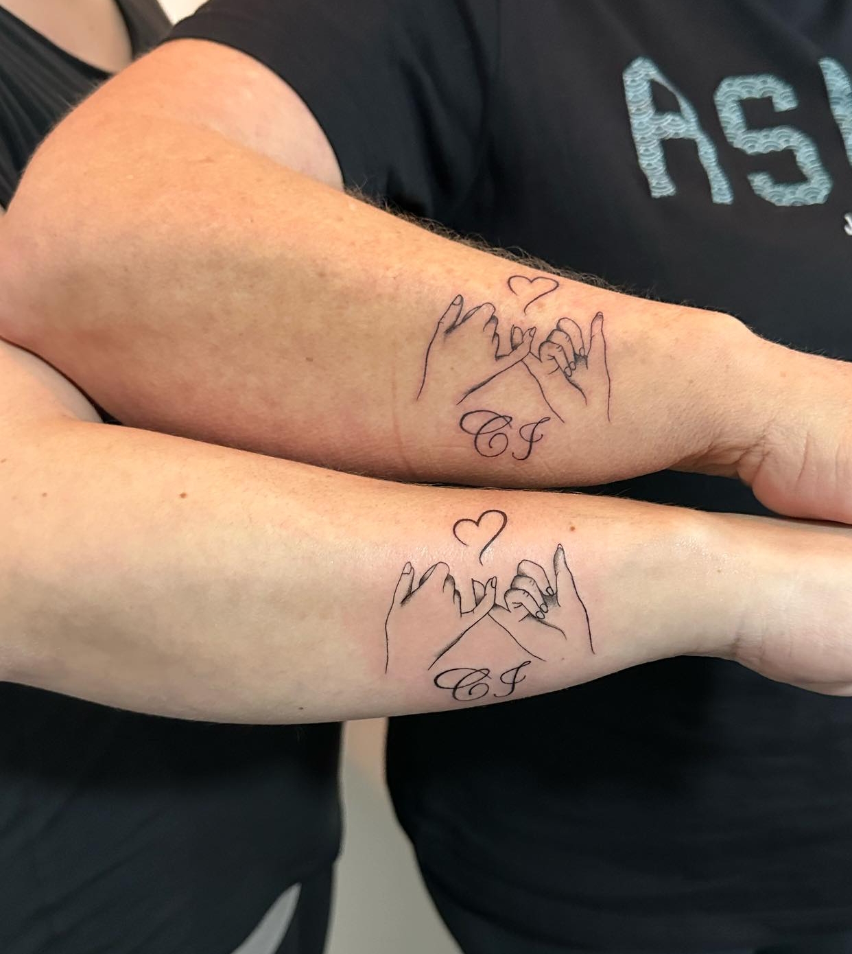 Mother-Daughter Initials Tattoos on Arms