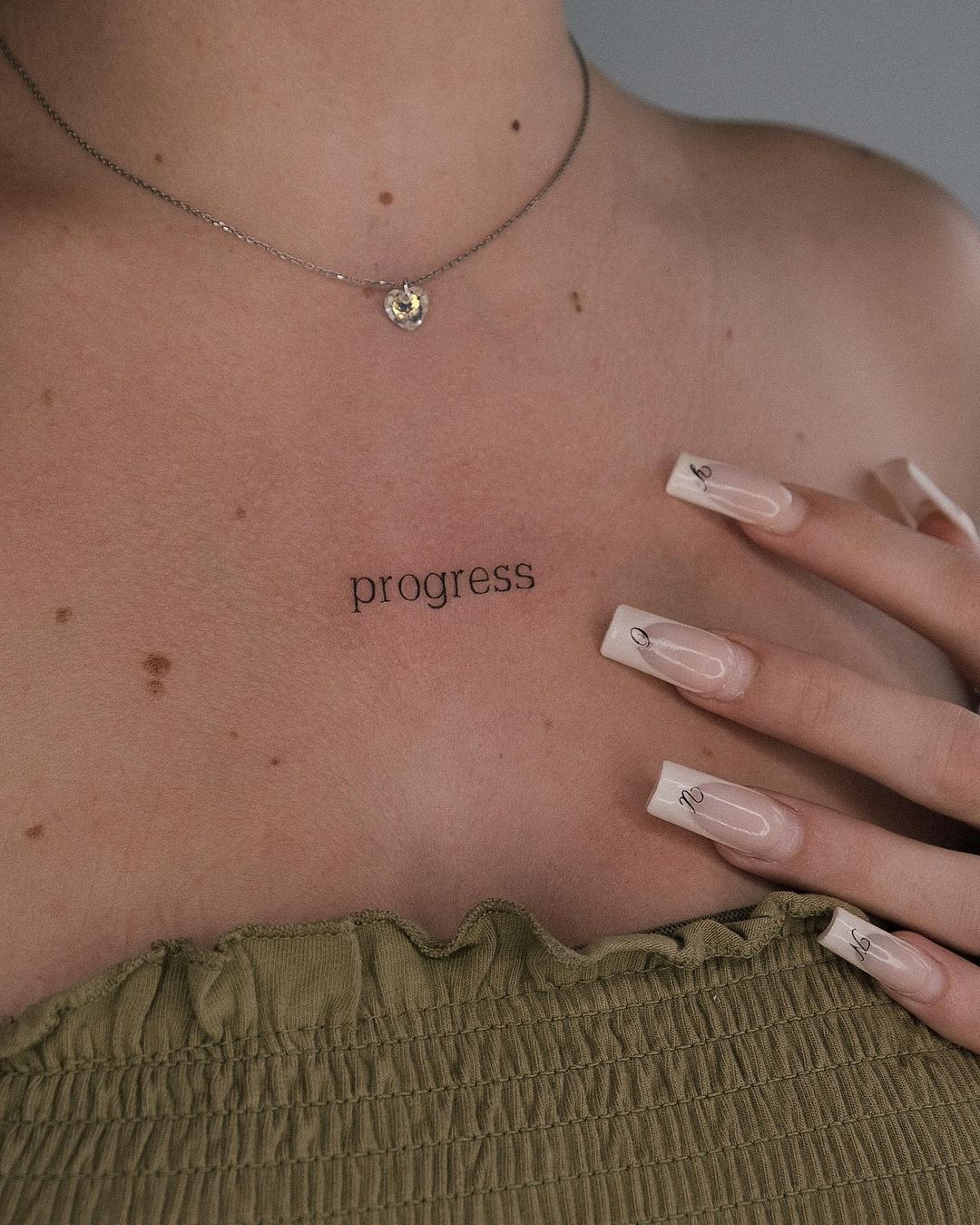 One Word Tattoo on Chest for Women