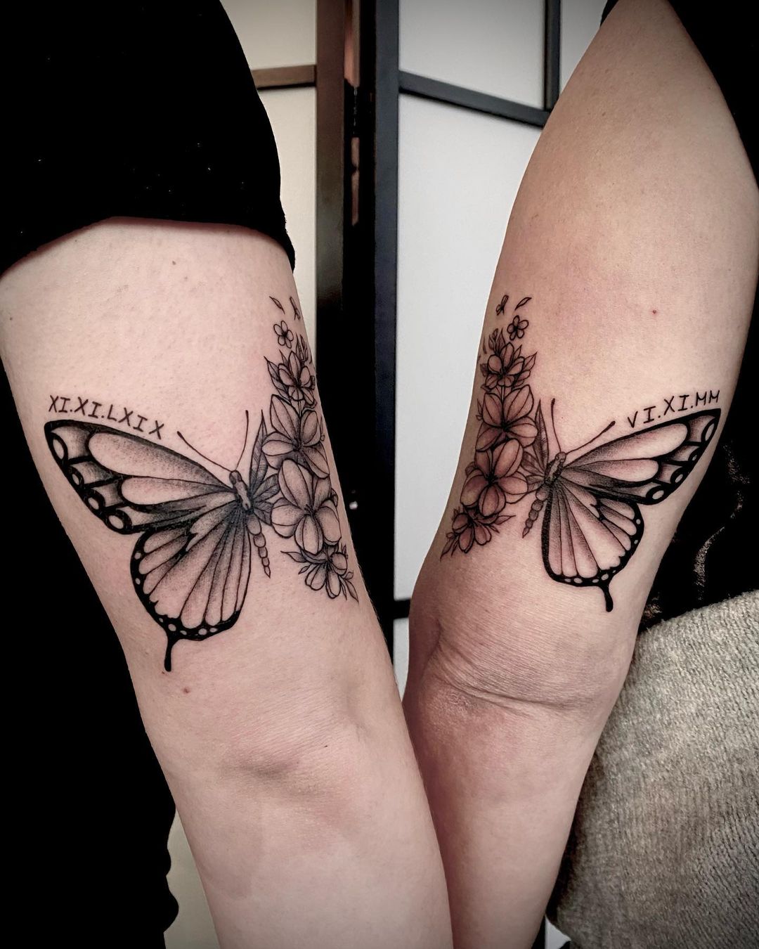 Matching Black Butterfly Tattoos on Arm