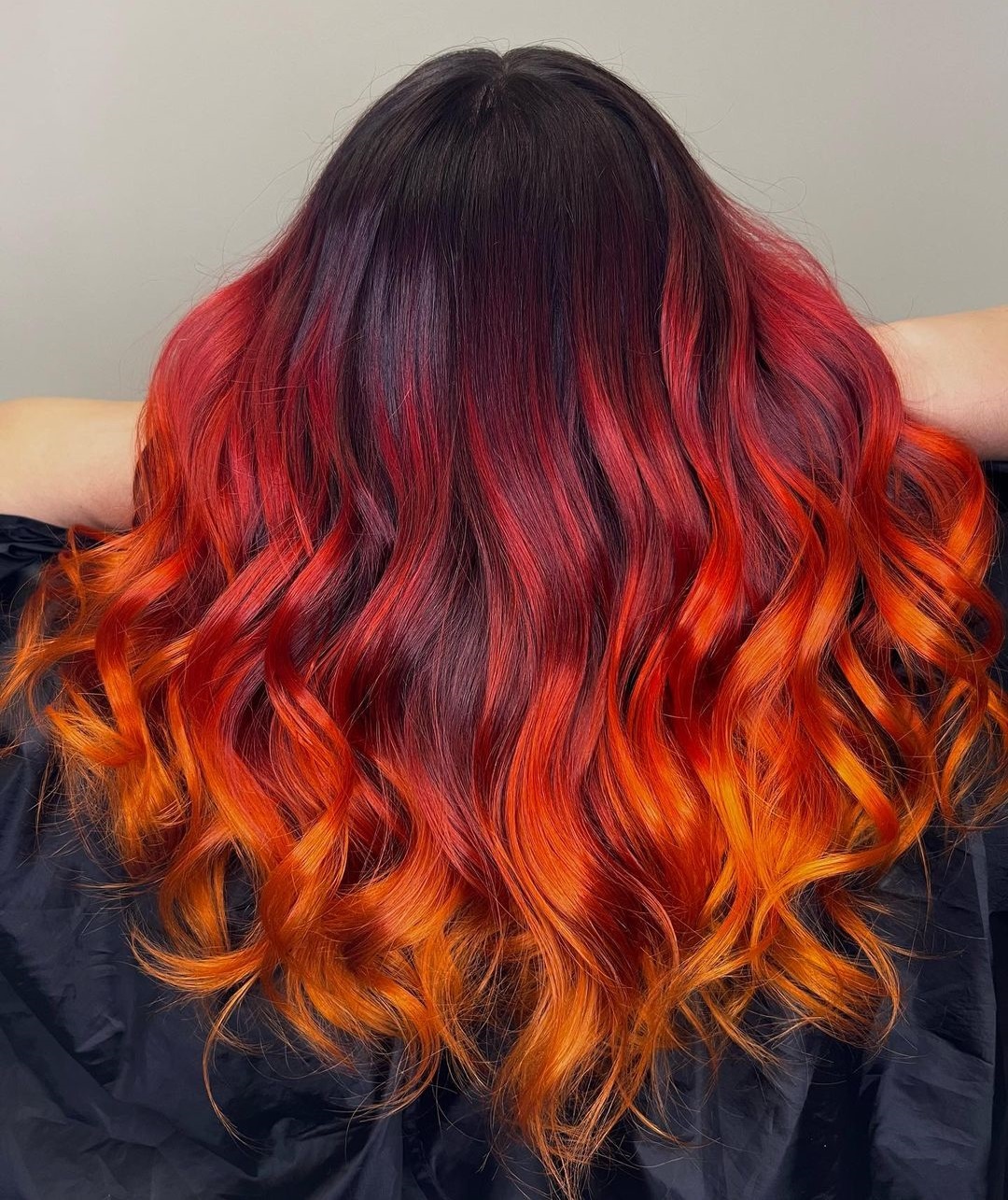Burgundy to Orange Ombre on Long Wavy Hair