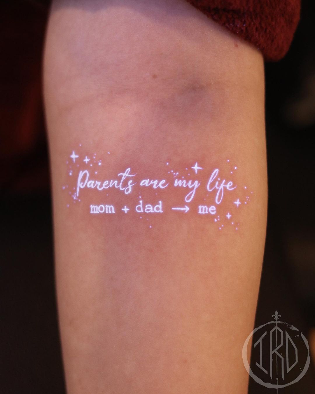 Glowing Family Quote Tattoo on Arm