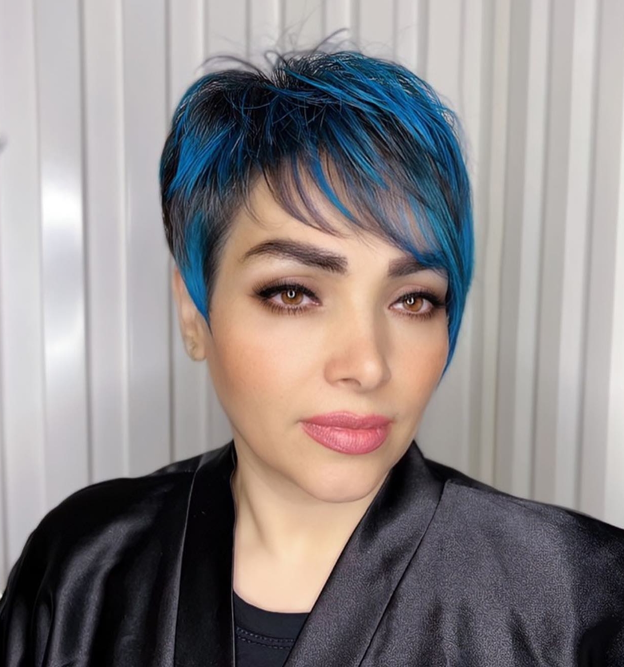 Pixie Cut with Blue Highlights and Side Swept Bang