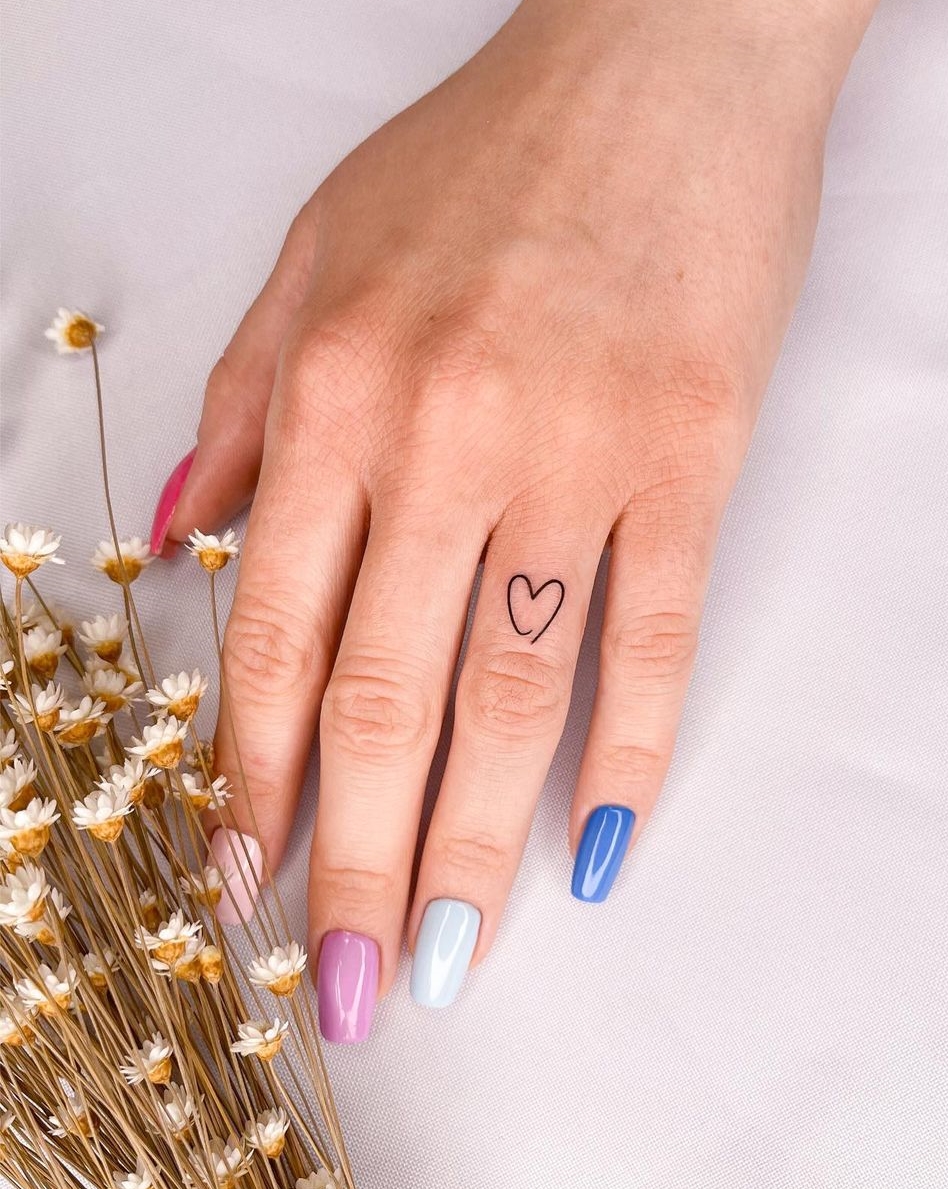 Tiny Heart Tattoo on Ring Finger