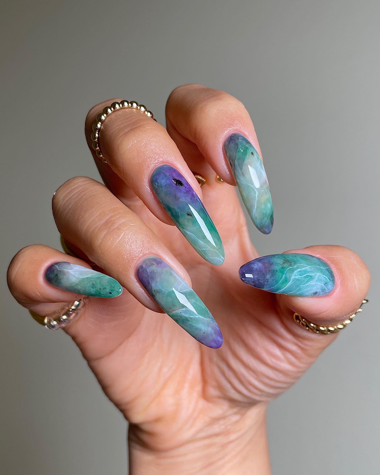 Long Purple to Green Marble Nails
