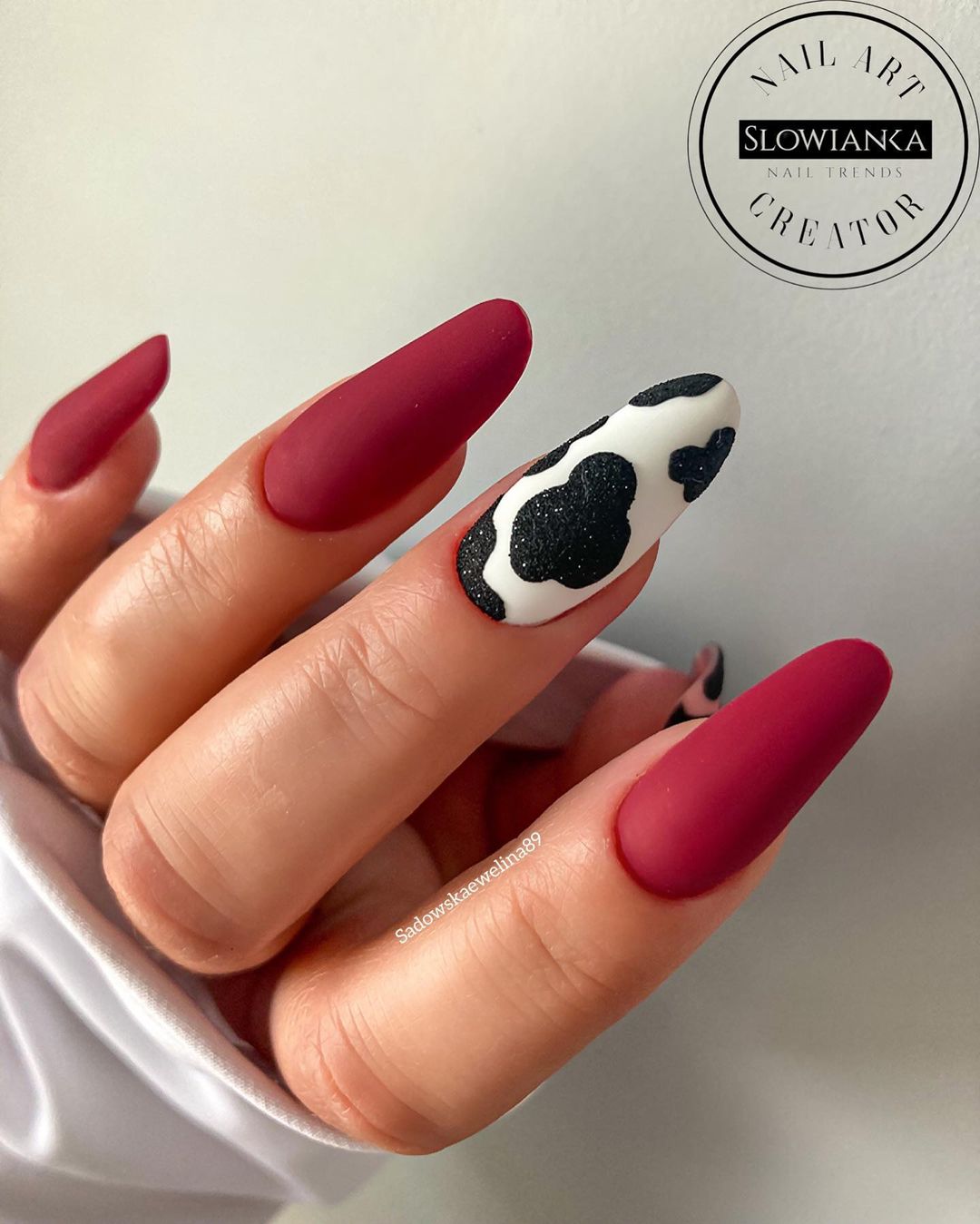 Dark Red Matte Nails with Black and White Cow Print