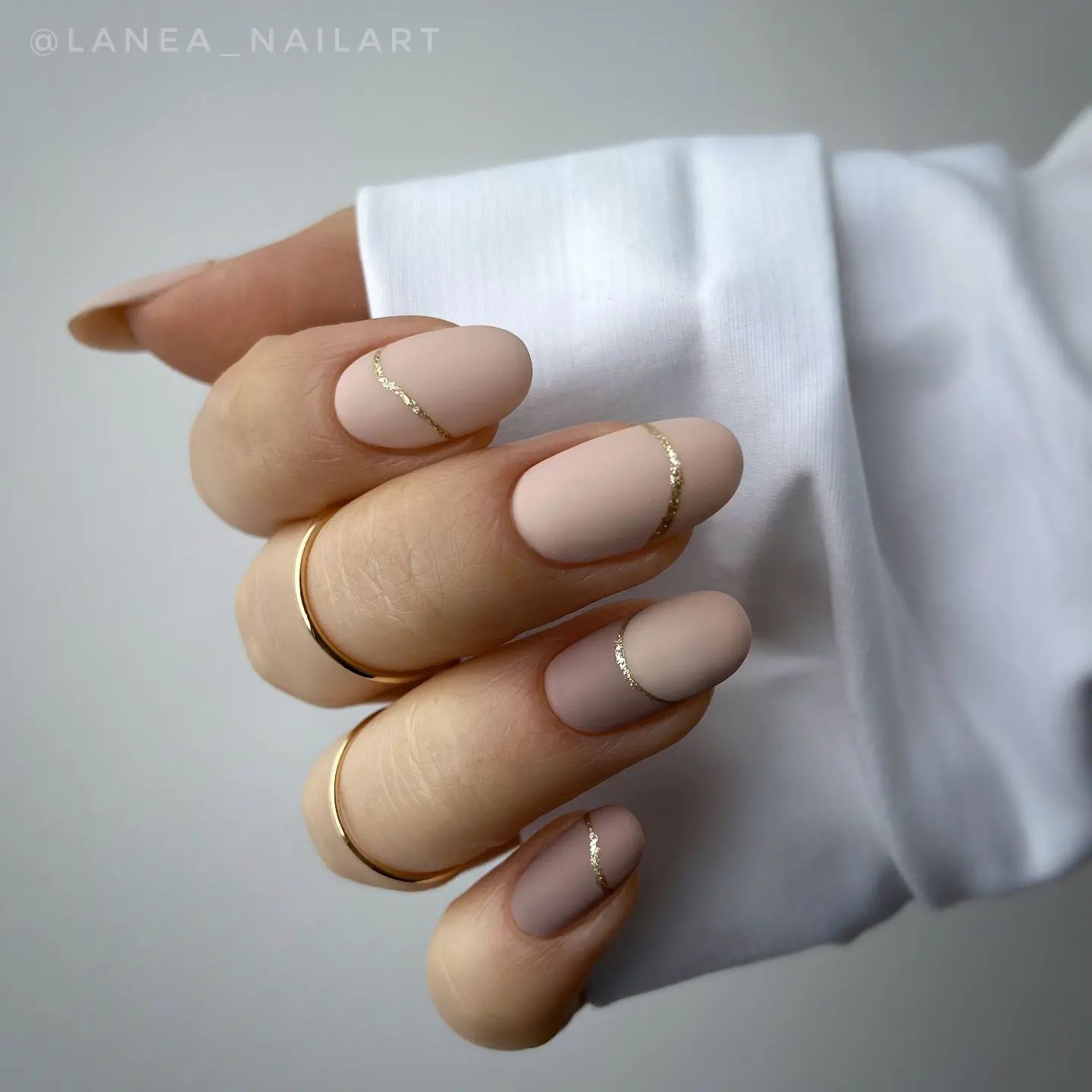 Short Round Matte Beige Nails with Golden Lines