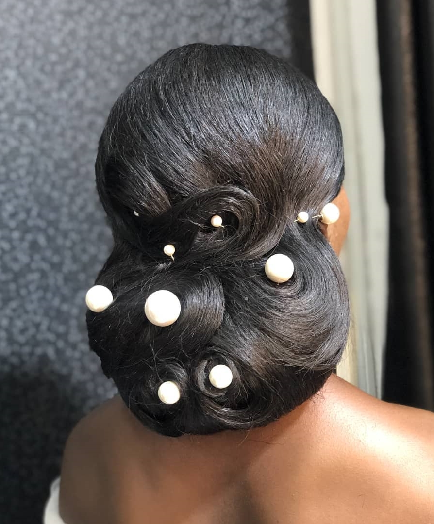 Thick Black Wedding Hairstyle with Big Pearl Pins